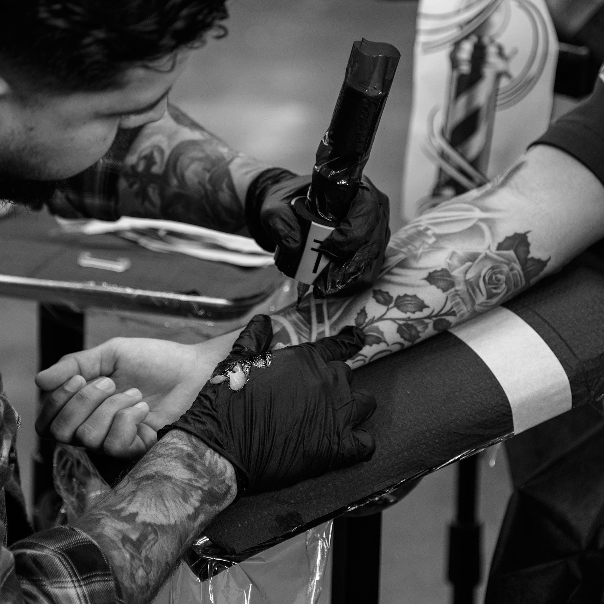 Closeup of a tattoo machine during a tattoo service at Rich in Flesh in Livermore, CA