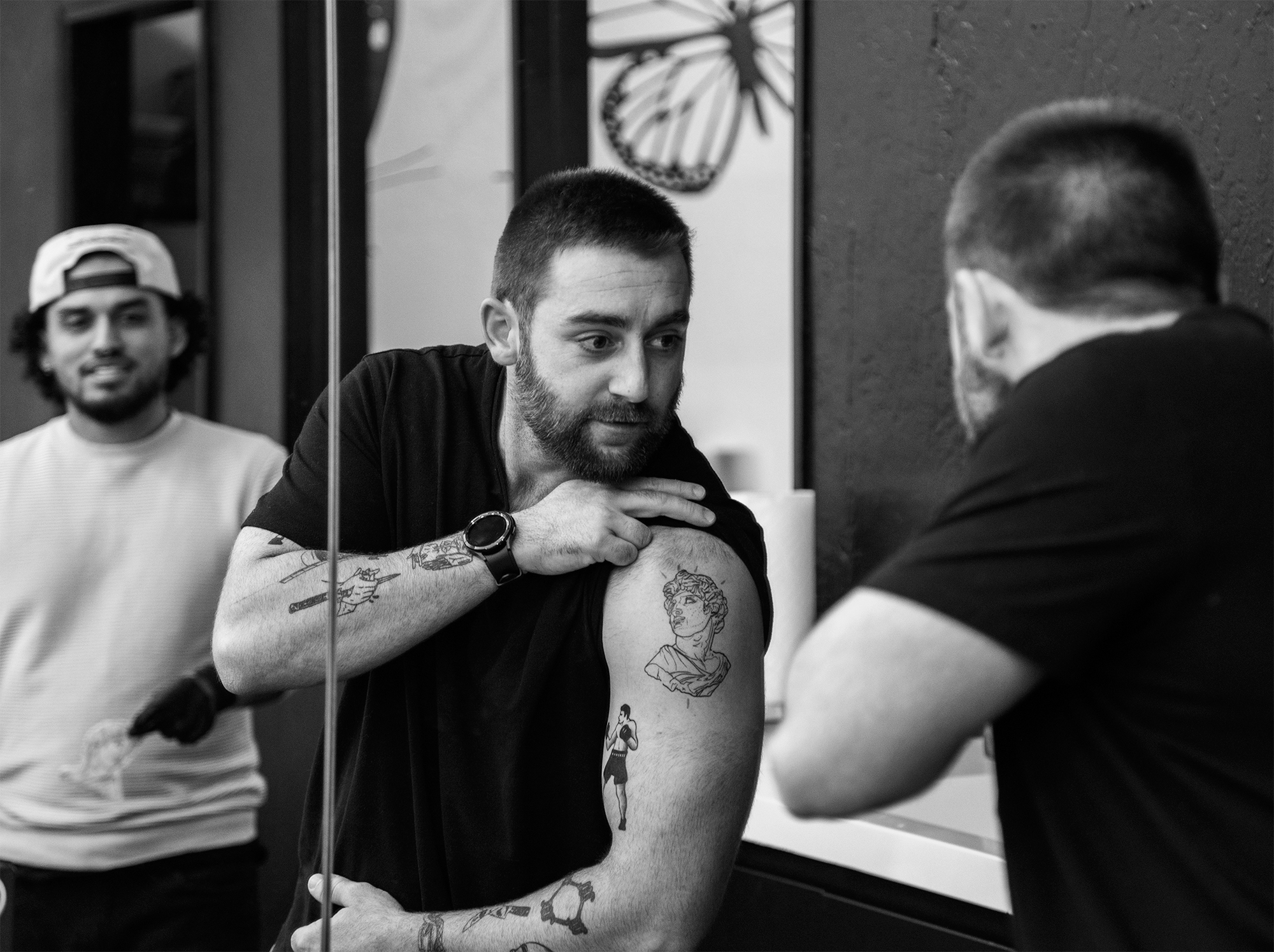 A man admiring his tattoo from Rich in Flesh in Livermore, CA
